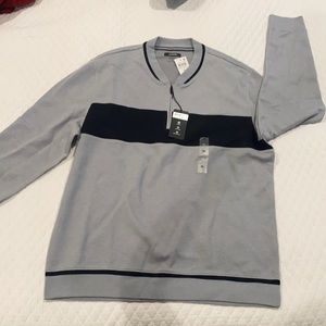 Gray and black stretch sweater.